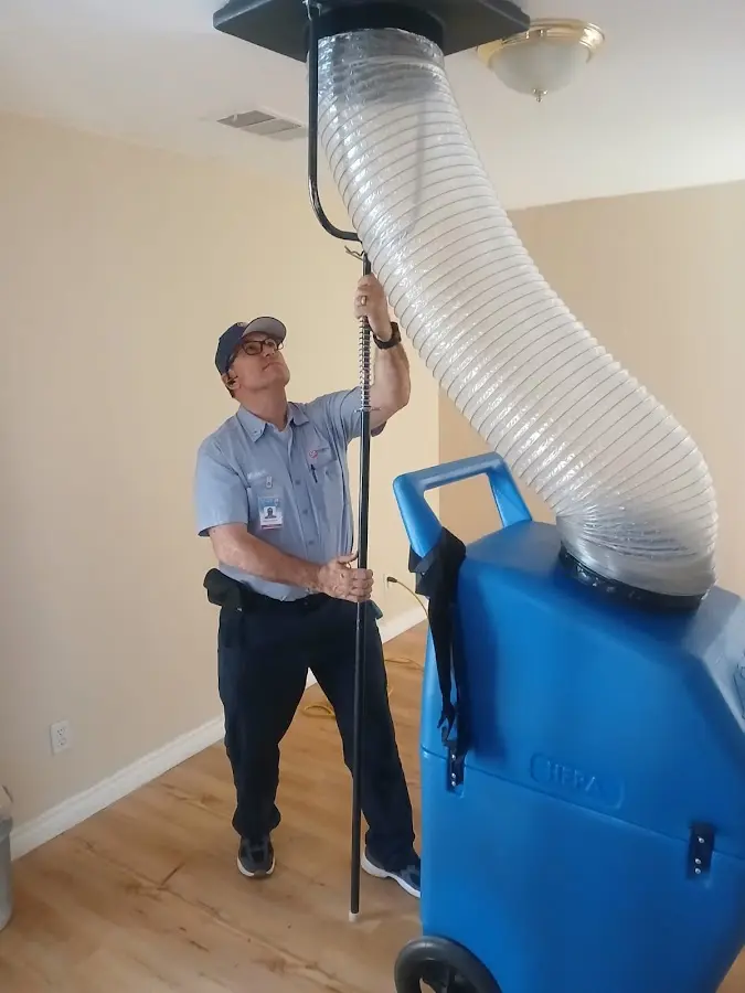 Mini Split Installation technician using HEPA equipment in Brush